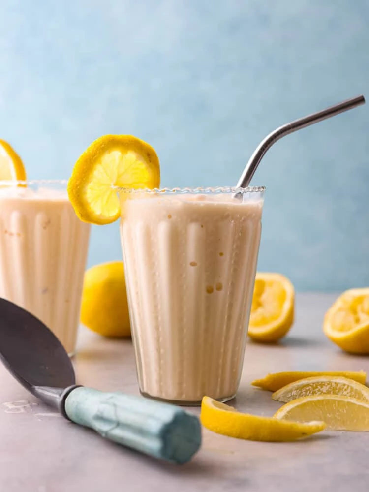 Creamy Chick-fil-A copycat frosted lemonade in a glass with lemon slices