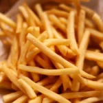 Homemade perfect French fries with crispy edges and fluffy interior.