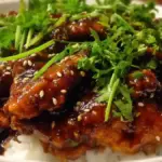 Delicious Slow Cooker Honey Soy Chicken served with rice and vegetables.