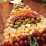 Beautiful Christmas Tree shaped charcuterie board with seasonal snacks