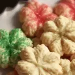Batch of easy Christmas spritz cookies on a festive plate