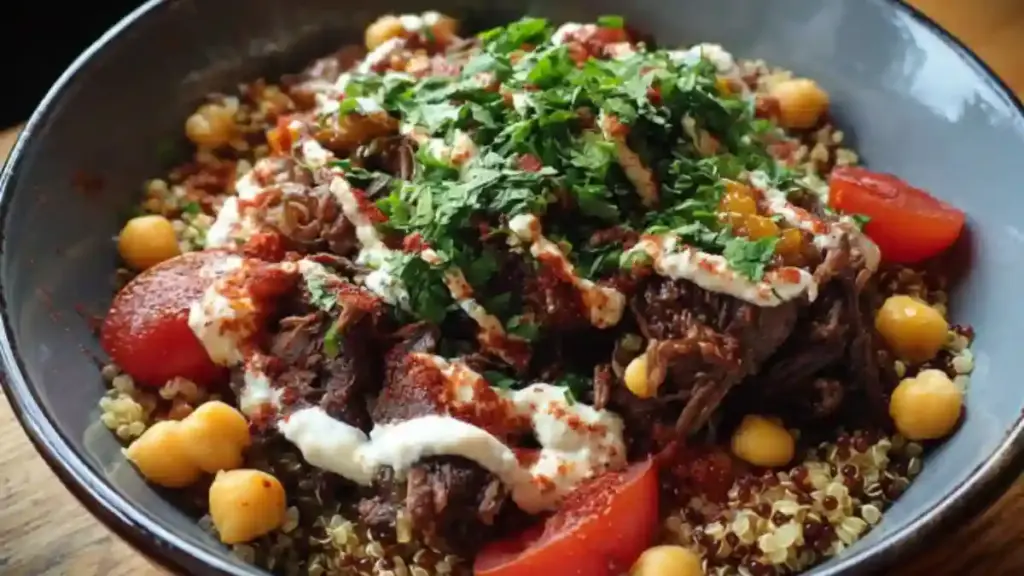Quinoa Beef Bowl with Tahini Dressing garnished with fresh ingredients