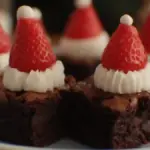 Santa Hat Brownies with whipped cream and strawberry toppings for Christmas