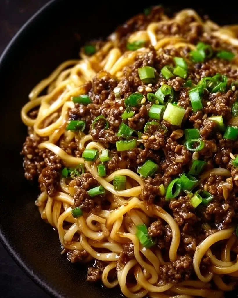 Mongolian Ground Beef Noodles served with colorful vegetables in a bowl