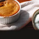 Delicious baked pumpkin spice pudding served in a dessert dish