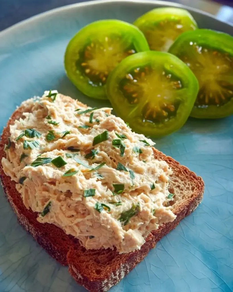 Vegan Basil Lemon Spread in a bowl with fresh basil and lemon slices