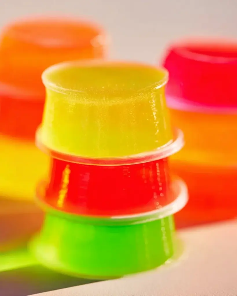 Colorful vodka jello shots on a party table ready to be served.