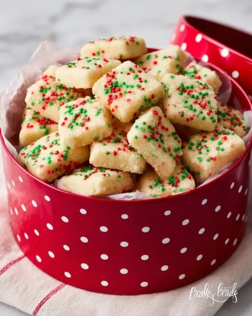 Festive Christmas Shortbread Cookie Bites arranged on a decorative plate