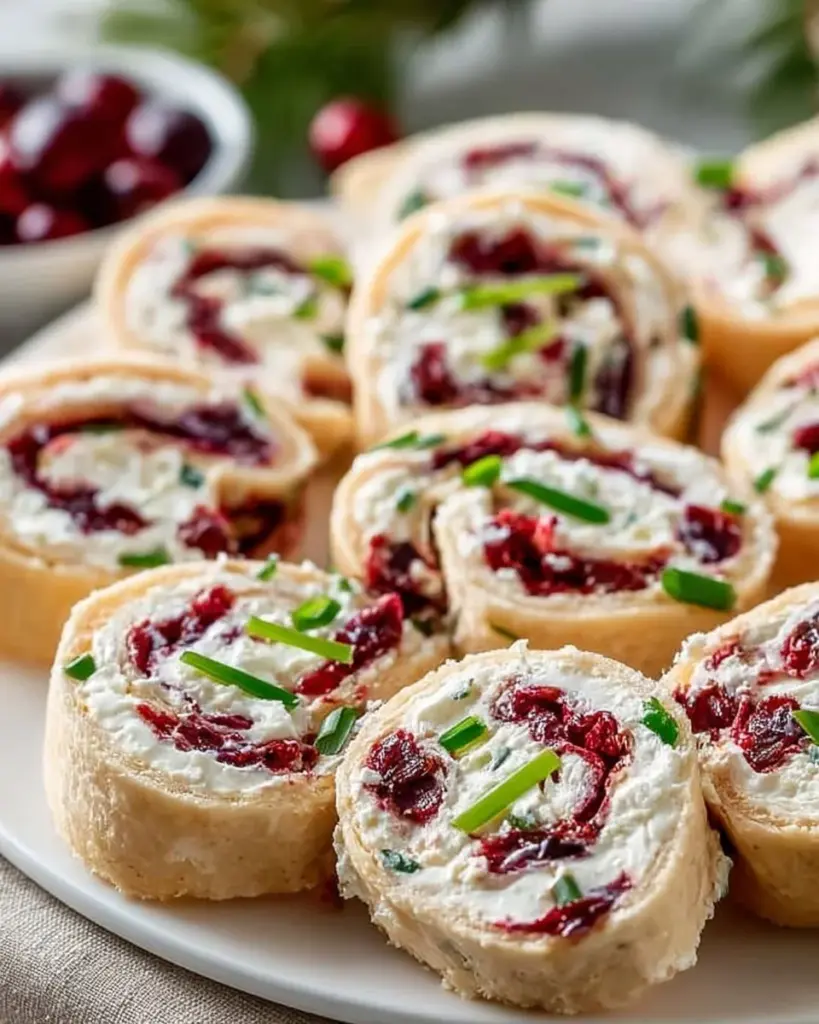 Delicious festive Christmas Cranberry Roll Ups served on a platter for holiday gatherings